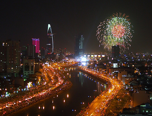 TOURISTS JUBILANTLY WELCOME NEW YEAR IN SAIGON WESTERN TOWN